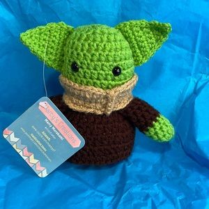 Holding Baby Yoda, six inches tall. Handcrafted with ❤️